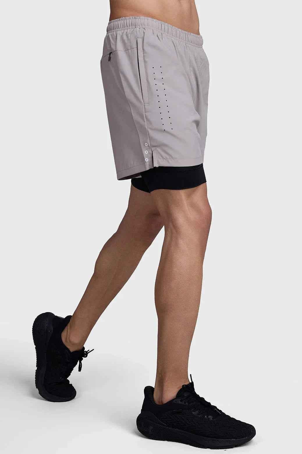 Fuaark Nz 2-in-1 laser shorts in beige with black accents, showcasing stylish design and comfortable fit.