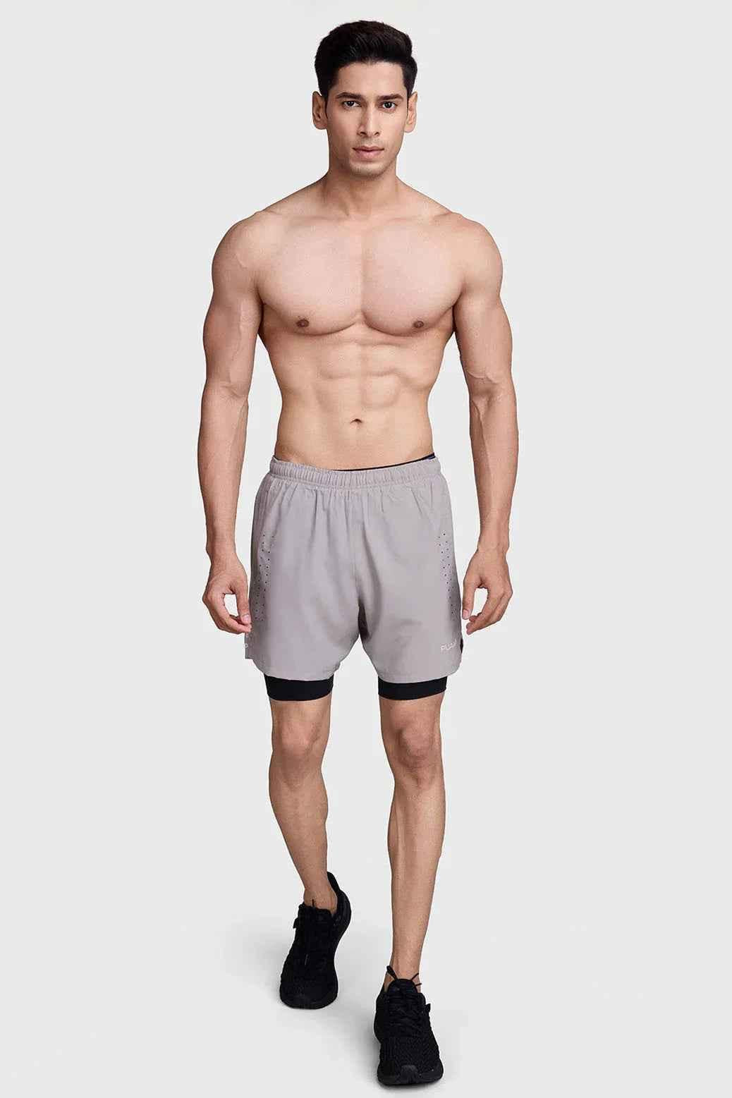 Beige and black 2-in-1 laser shorts by Fuaark NZ, featuring a stylish and comfortable design for active wear.