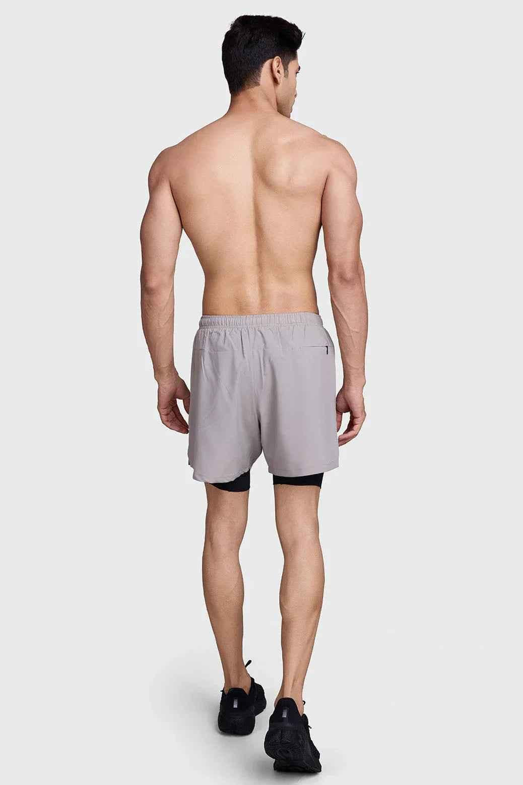 Beige 2-in-1 laser shorts with black accents from Fuaark NZ, featuring a stylish and comfortable design for casual wear.