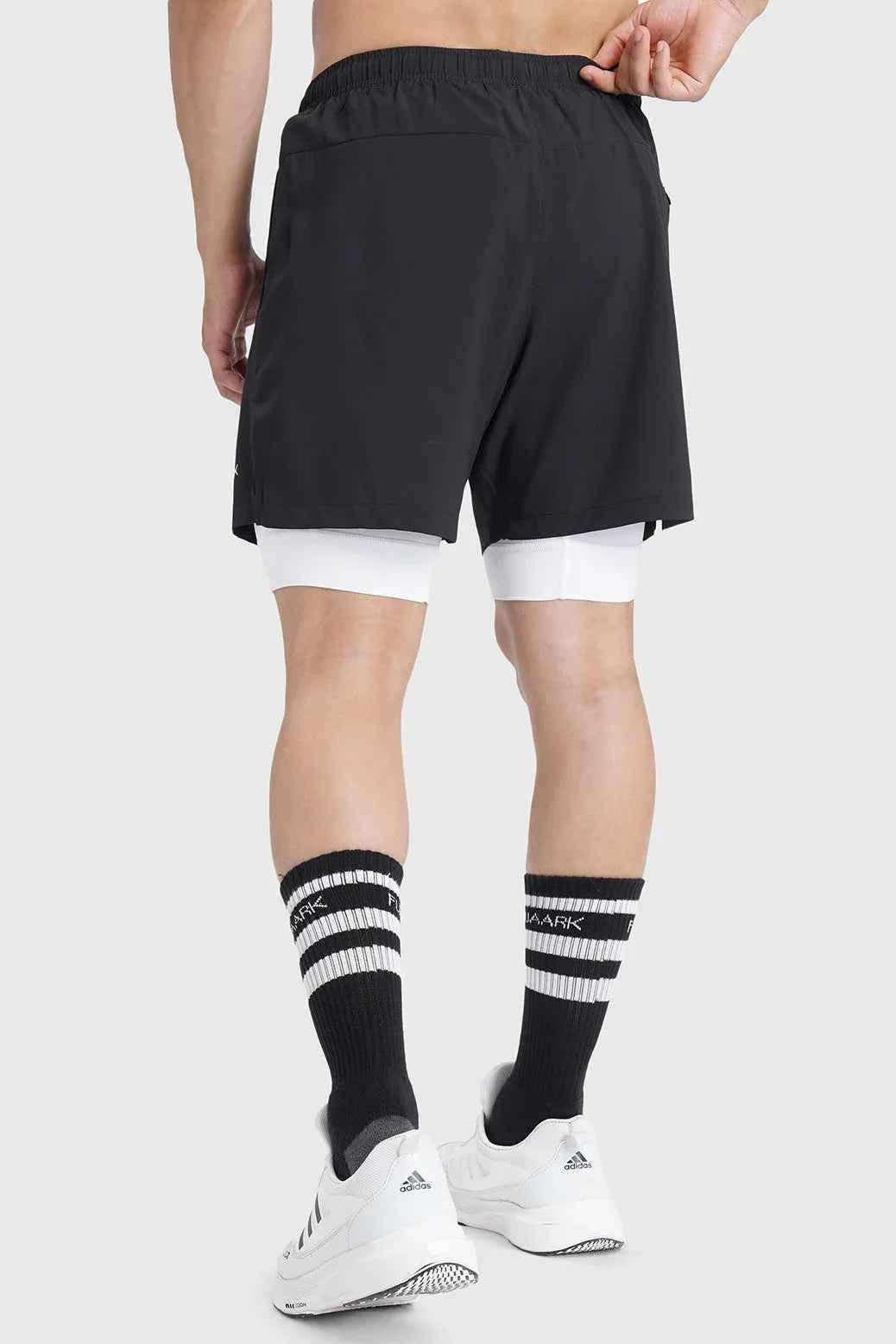 Black 2-in-1 laser shorts by Fuaark Nz, versatile activewear shorts with stylish design and adjustable fit for active use.
