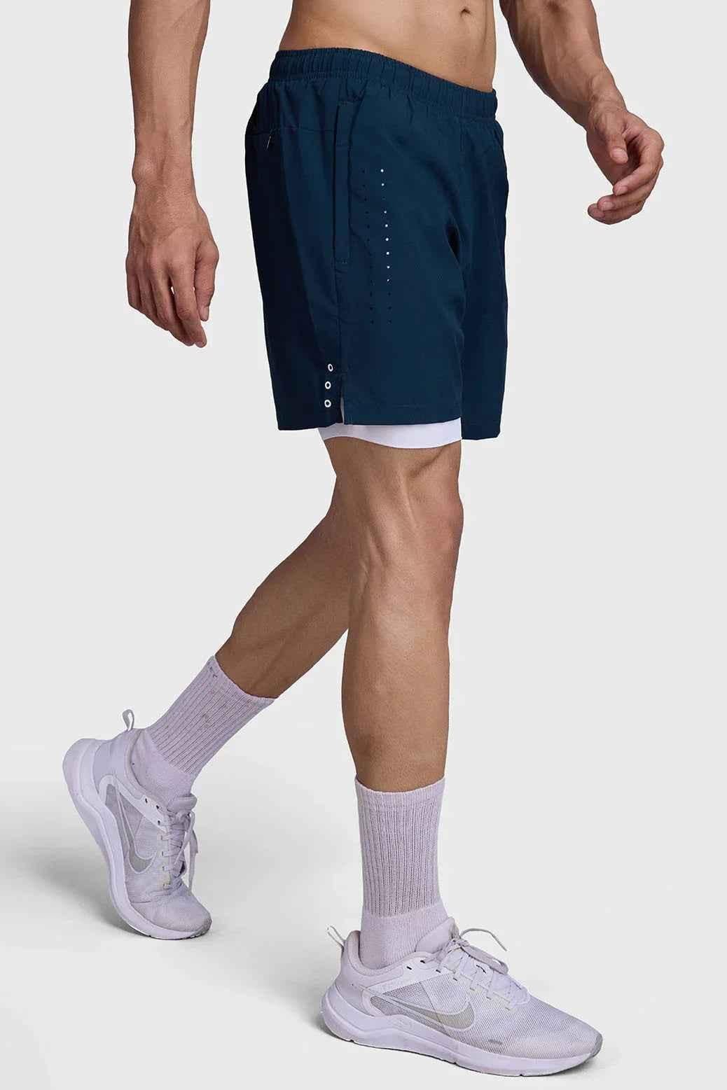 Fuaark Nz 2-in-1 laser shorts in pine green, casual athletic shorts with a sleek design and comfortable fit.