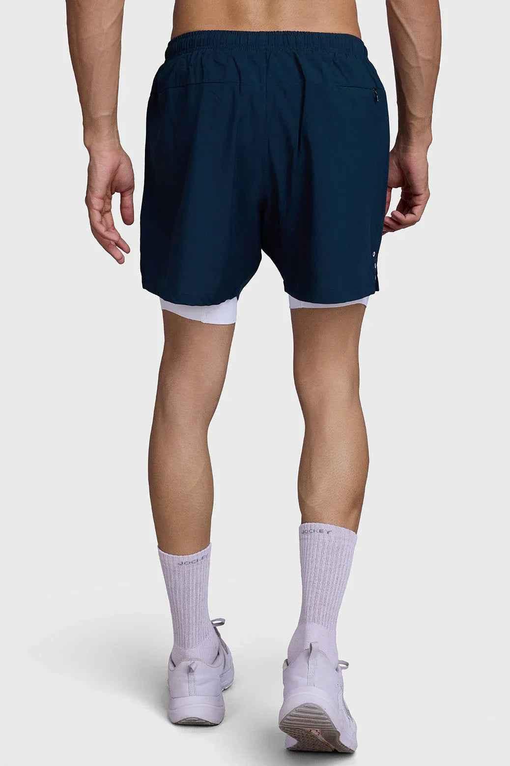 Fuaark Nz 2-in-1 Laser Shorts in pine green, showcasing the stylish athletic shorts with sleek laser detailing and comfortable fit.