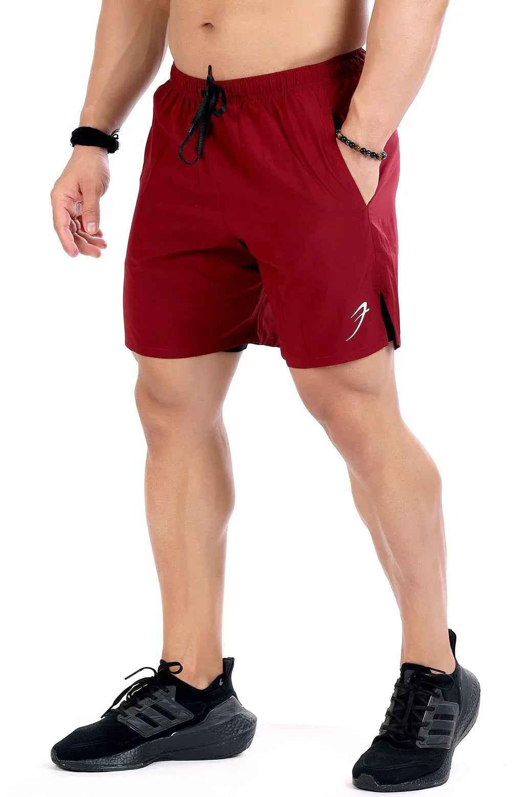Fuaark Nz 2-in-1 maroon compression shorts designed for comfort and performance, shown on a model.