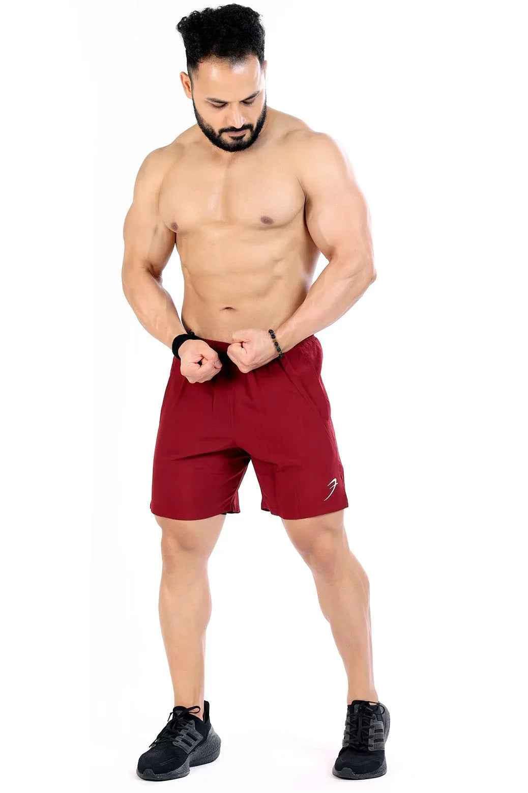Fuaark Nz 2-in-1 maroon compression shorts designed for comfort and performance, featuring stretch fabric and a sleek fit.