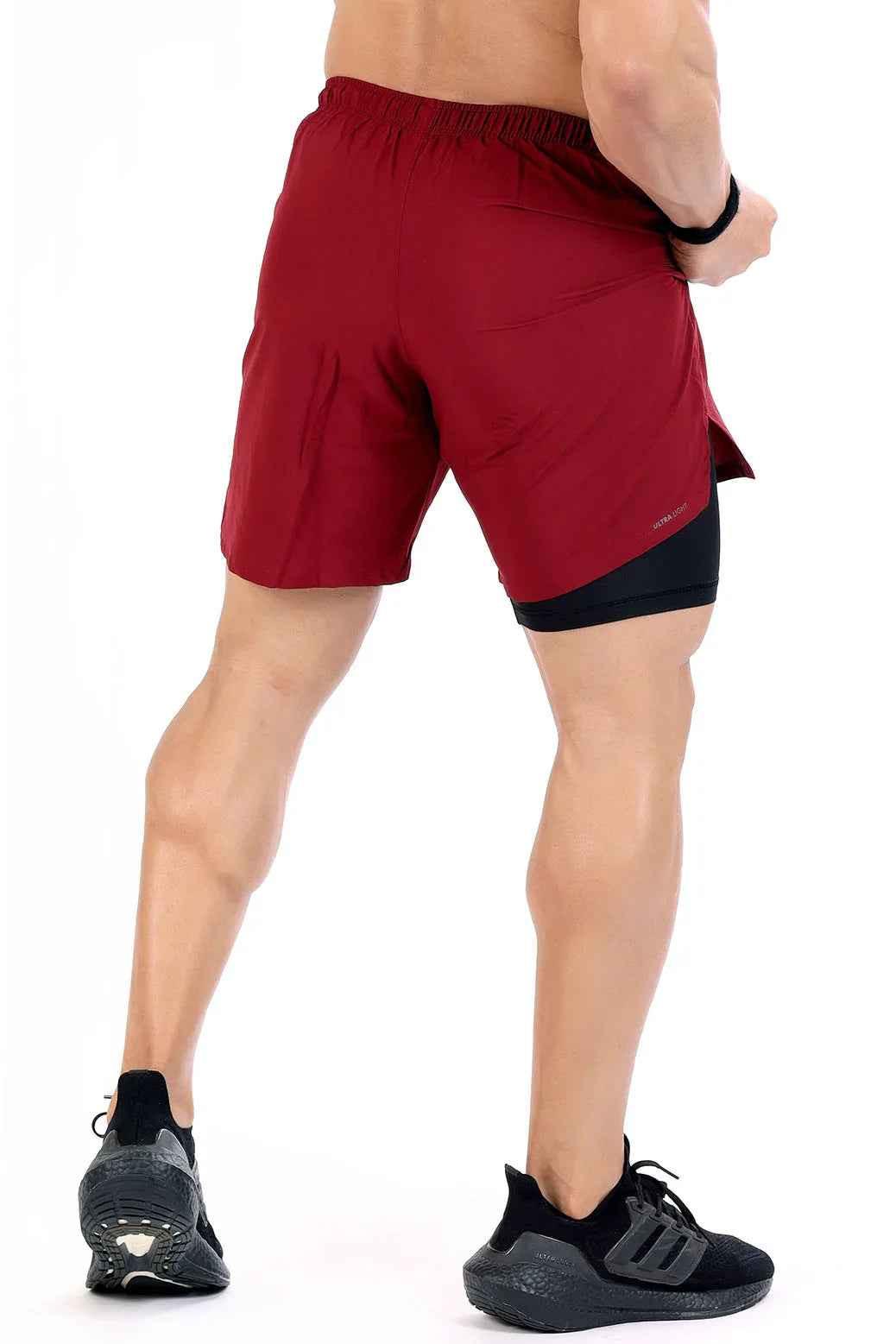Fuaark Nz 2-in-1 maroon compression shorts designed for comfort and performance, featuring a snug fit and athletic style.