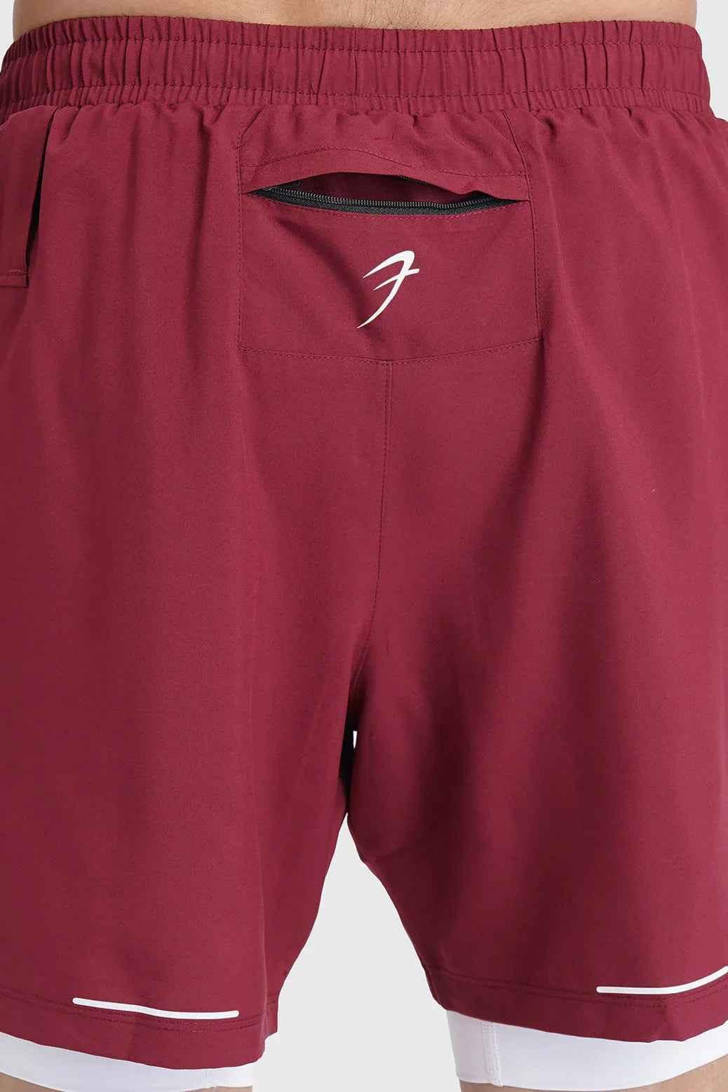 Fuaark Nz 2-in-1 maroon mesh shorts for men, featuring breathable fabric and stylish design for comfort and casual wear.