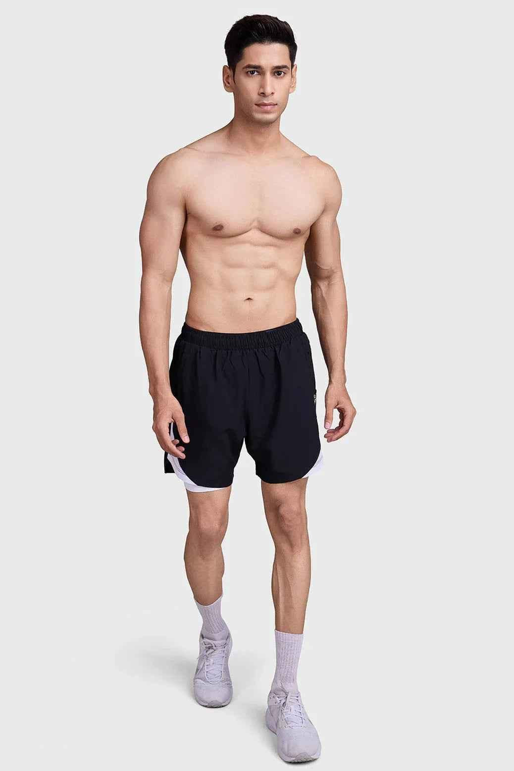 Black and white 2-in-1 mesh shorts by Fuaark Nz, featuring breathable fabric and sporty design.