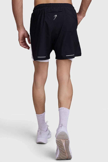 Black and white 2-in-1 mesh shorts by Fuaark Nz showing breathable fabric and sporty design for active wear.