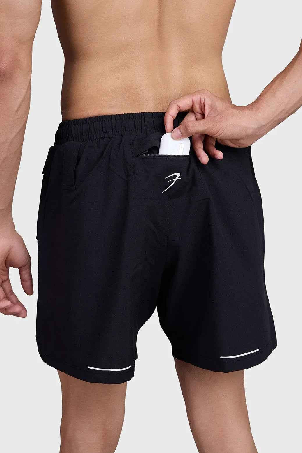 Black and white 2-in-1 mesh shorts by Fuaark NZ, featuring breathable fabric and a stylish athletic design.