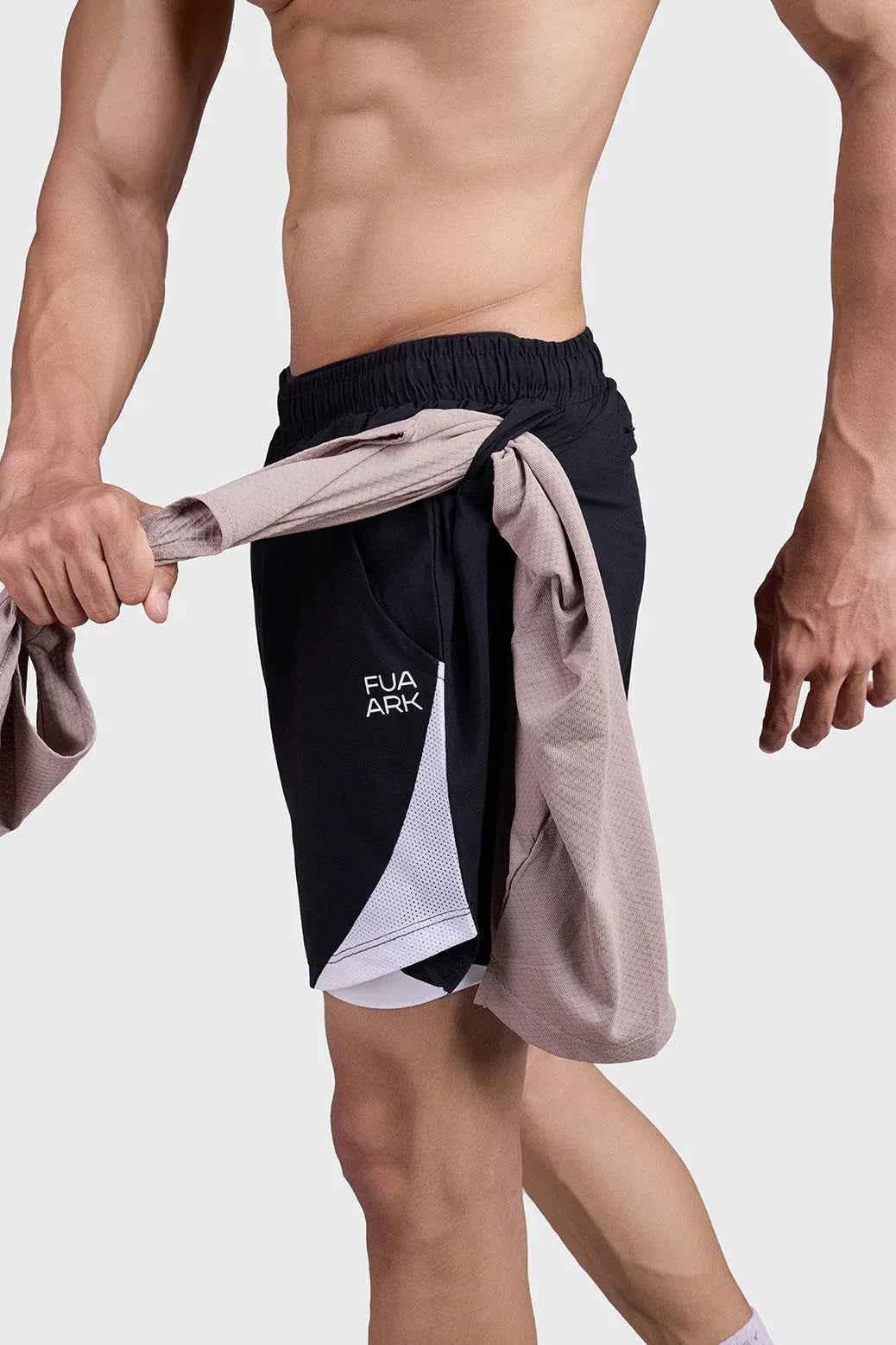 Black and white 2-in-1 mesh shorts by Fuaark Nz, featuring breathable fabric and stylish athletic design.