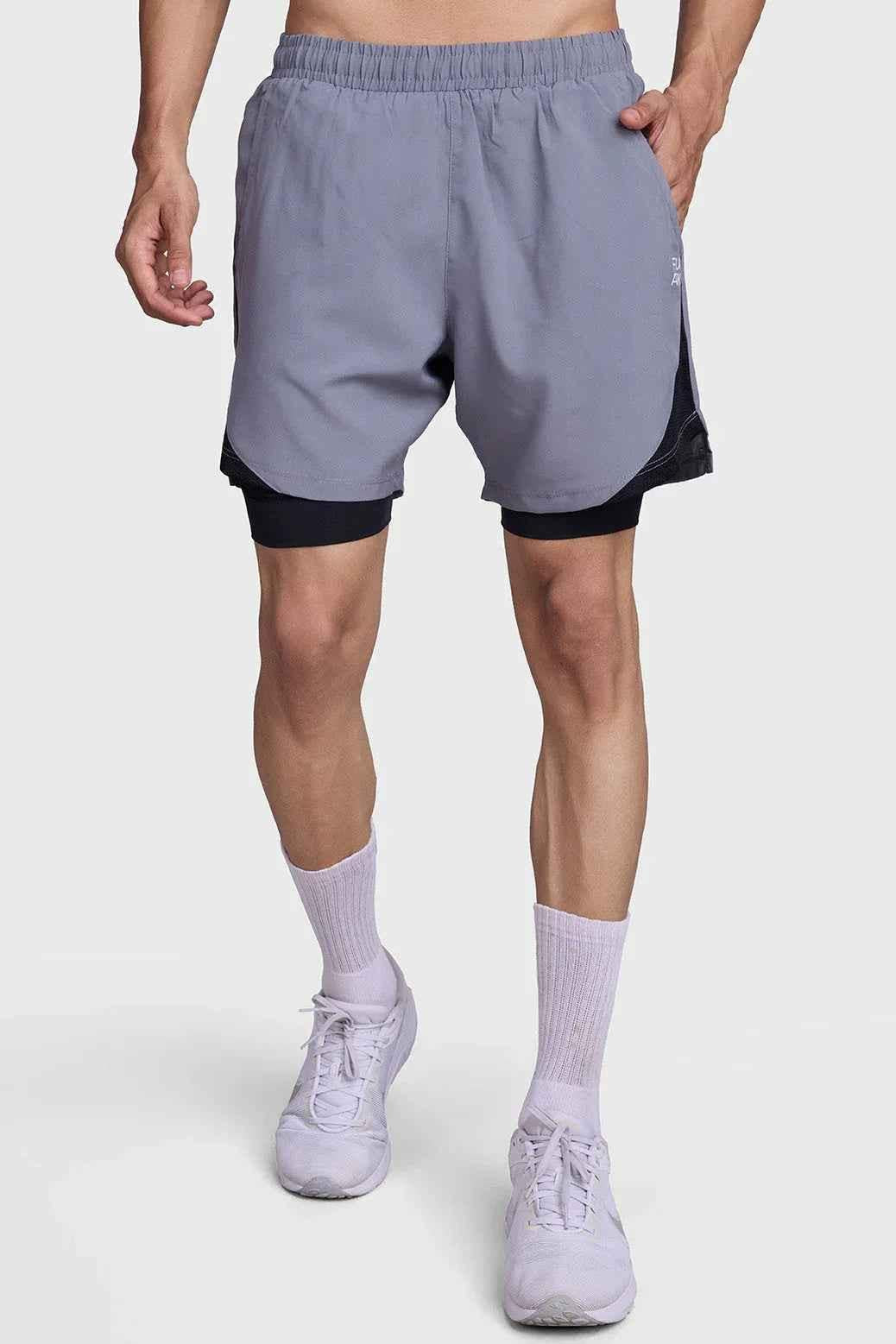 Fuaark NZ 2-in-1 mesh shorts in foggy grey with black accents, featuring lightweight breathable fabric and adjustable waistband.