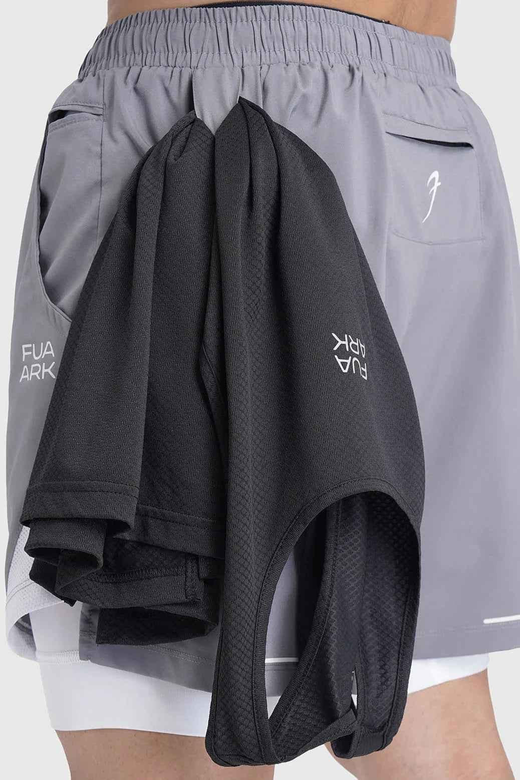 Fuaark Nz 2-in-1 mesh shorts in foggy grey with white accents, featuring lightweight breathable fabric and sporty design.