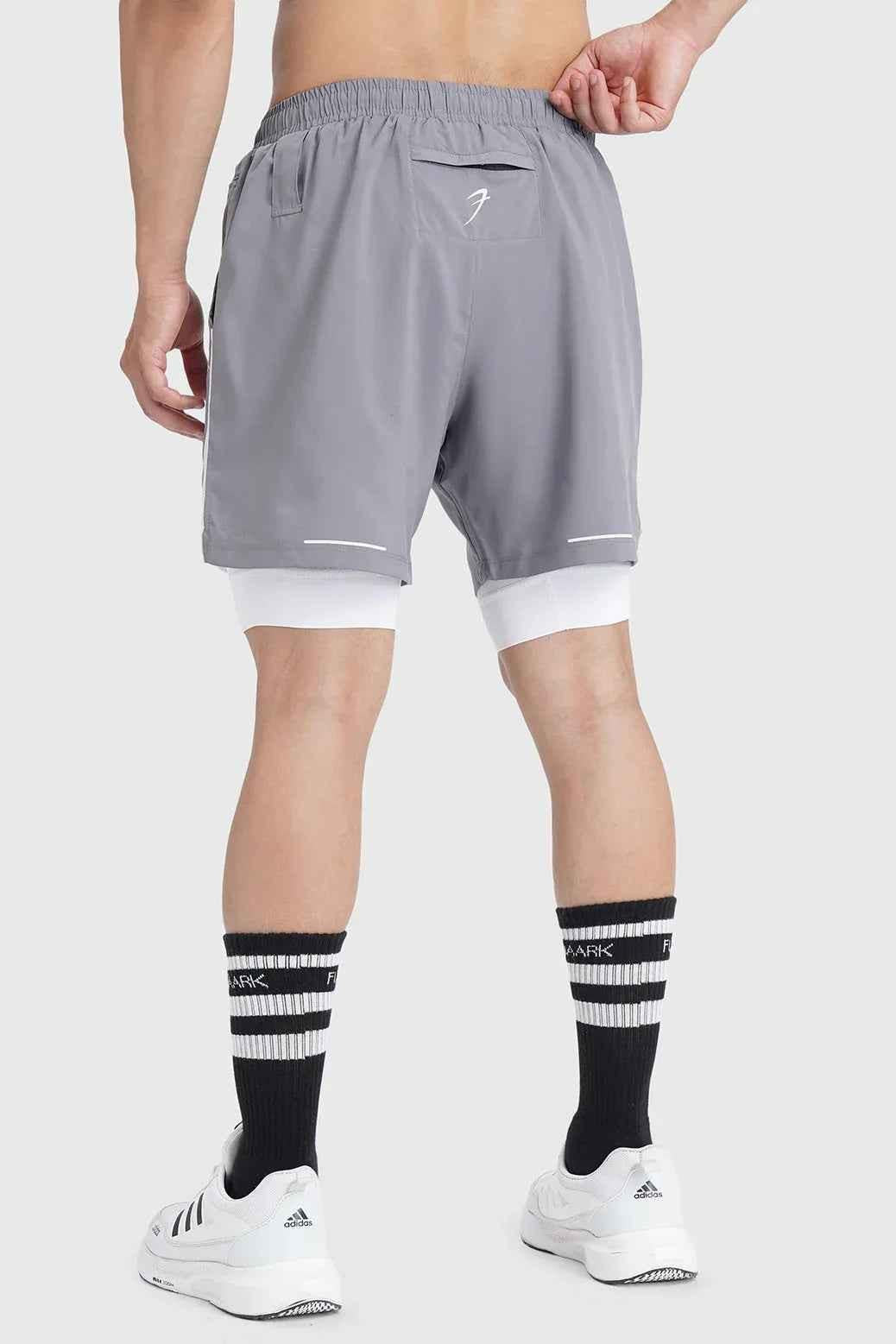 Fuaark NZ 2-in-1 mesh shorts in foggy grey with white accents, featuring lightweight breathable fabric and sporty design.