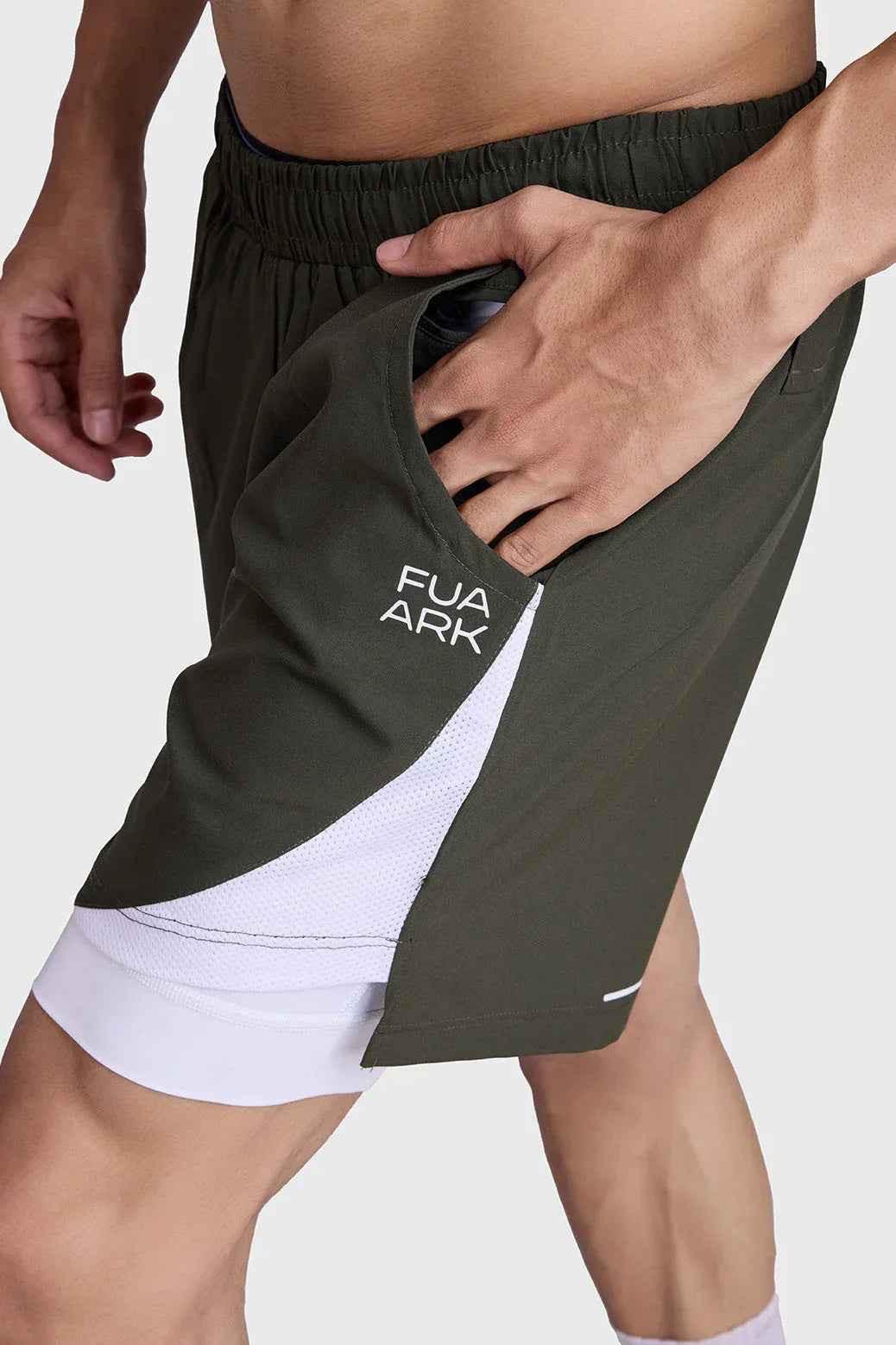 Olive 2-in-1 mesh shorts by Fuaark Nz with breathable fabric and adjustable waistband, suitable for athletic activities.