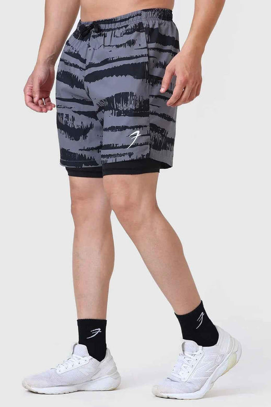 Fuaark Nz 2-in-1 printed compression shorts in gold and grey, featuring a sleek design with comfortable fit and athletic style.