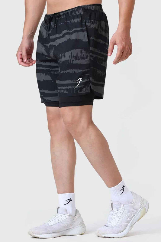 Fuaark Nz 2-in-1 printed olive compression shorts with stretchy fabric and bold design for active wear and comfort.