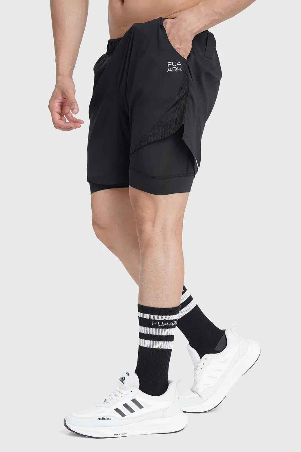 Black Fuaark NZ 2-in-1 mesh shorts with built-in support liner, designed for breathability and quick-dry performance.