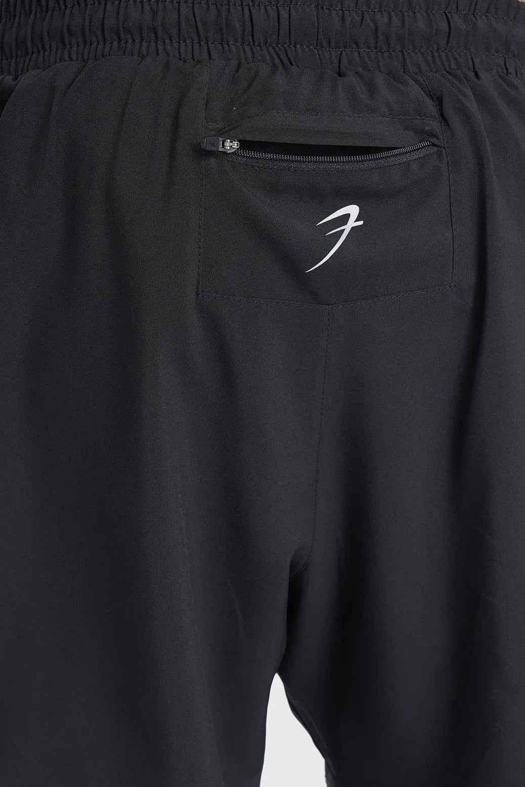 Black Fuaark Nz 2-in-1 mesh shorts with built-in support liner, designed for breathability and quick-dry performance.