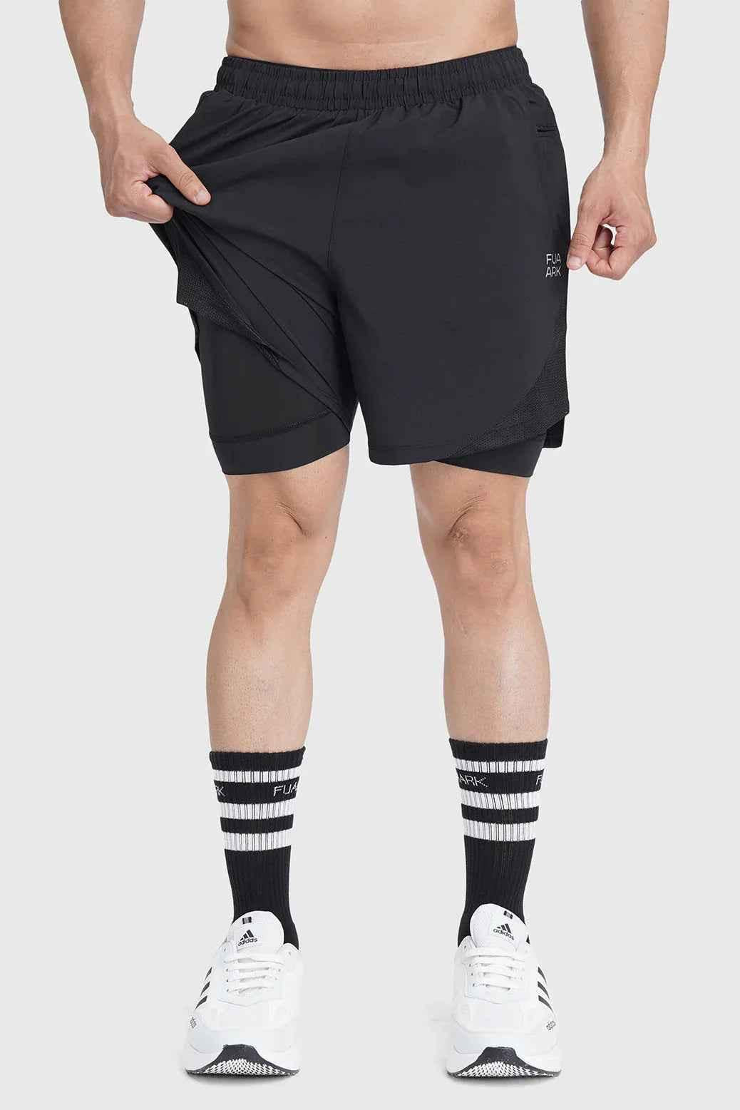 Black 2-in-1 mesh shorts with built-in support liner from Fuaark NZ, featuring breathable, quick-dry performance for active wear.