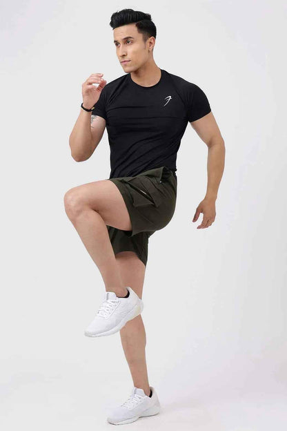 Fuaark NZ Delta Cargo Shorts in army green displayed on a model, featuring multiple pockets and a relaxed fit for casual wear.