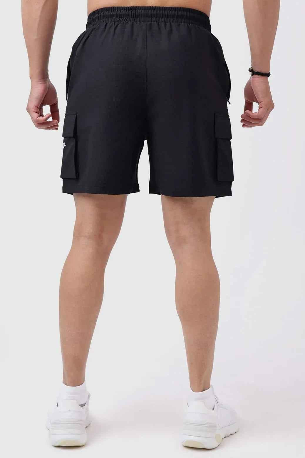 Black Delta Cargo Shorts by Fuaark NZ, featuring multiple pockets and a relaxed fit, designed for casual wear.