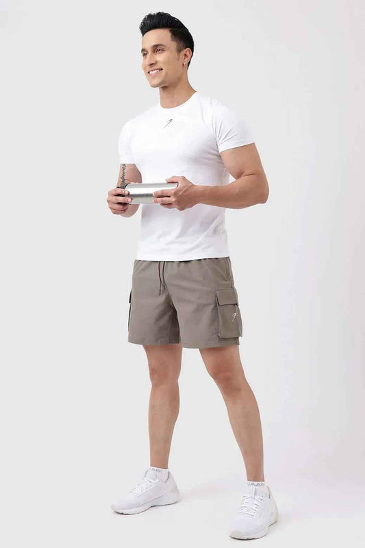 Fuaark NZ Delta Cargo Shorts in brown displayed on a model, featuring multiple cargo pockets and a casual fit.