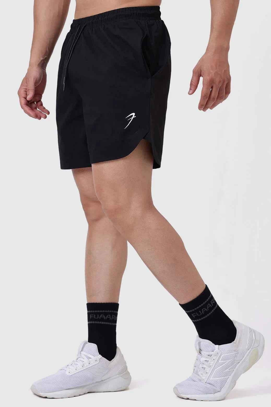 Black Fuaark Nz Edge Shorts laid flat, showcasing their design and fabric texture for men’s casual athletic wear.