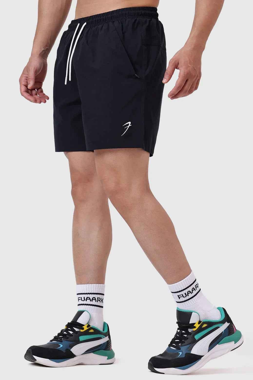 Black Fuaark Nz Nova Shorts laid flat, showcasing their stylish design and comfortable fit for casual wear.