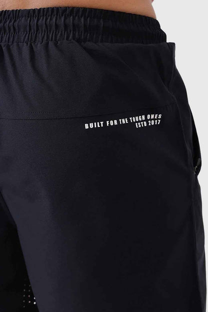 Black Nova Shorts by Fuaark Nz laid flat, showcasing their stylish design and comfortable fit in a casual fashion setting.