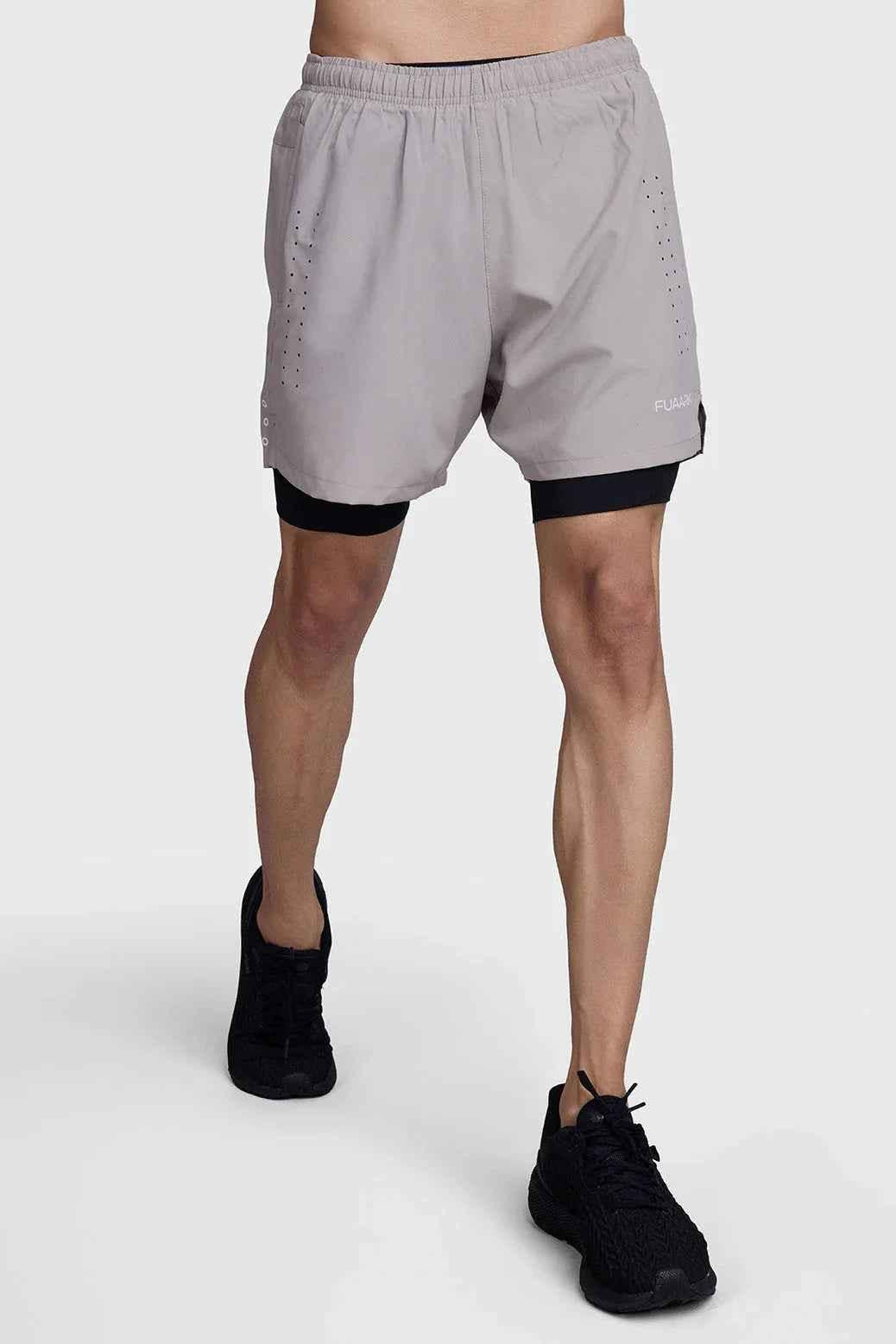 Fuaark Nz men's 2-in-1 laser shorts in beige and black designed for active workouts, featuring a sleek sporty style.
