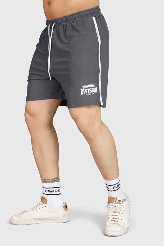 Gray Grit Shorts by Fuaark Nz, casual men's shorts with a relaxed fit and durable fabric, shown in a natural outdoor setting