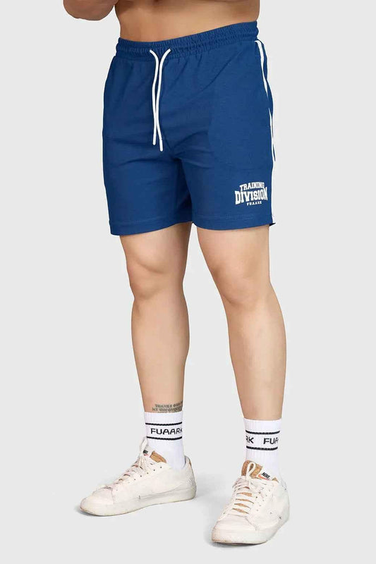 Fuaark Nz Grit Shorts Orion Blue displayed on a model, featuring a casual fit and vibrant blue color for outdoor activities.