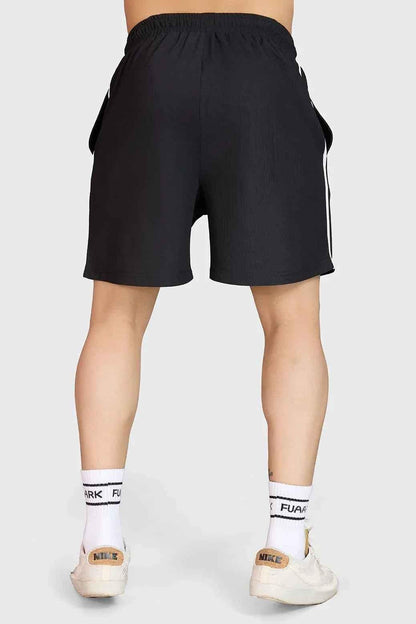 Fuaark Nz Grit Training Shorts for men, black athletic shorts designed for intense workouts and active training sessions.