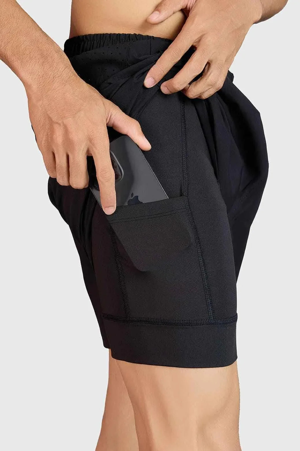 Black Hyper 5-inch running shorts by Fuaark NZ, designed for comfort and performance, shown on a model.