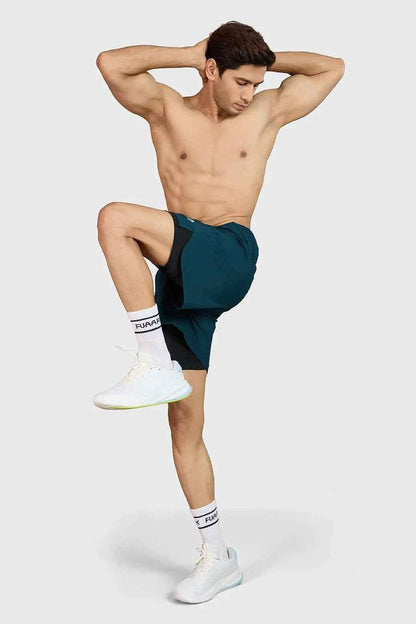 Deep green Hyper 5-inch running shorts by Fuaark Nz with lightweight fabric and athletic fit for active wear.