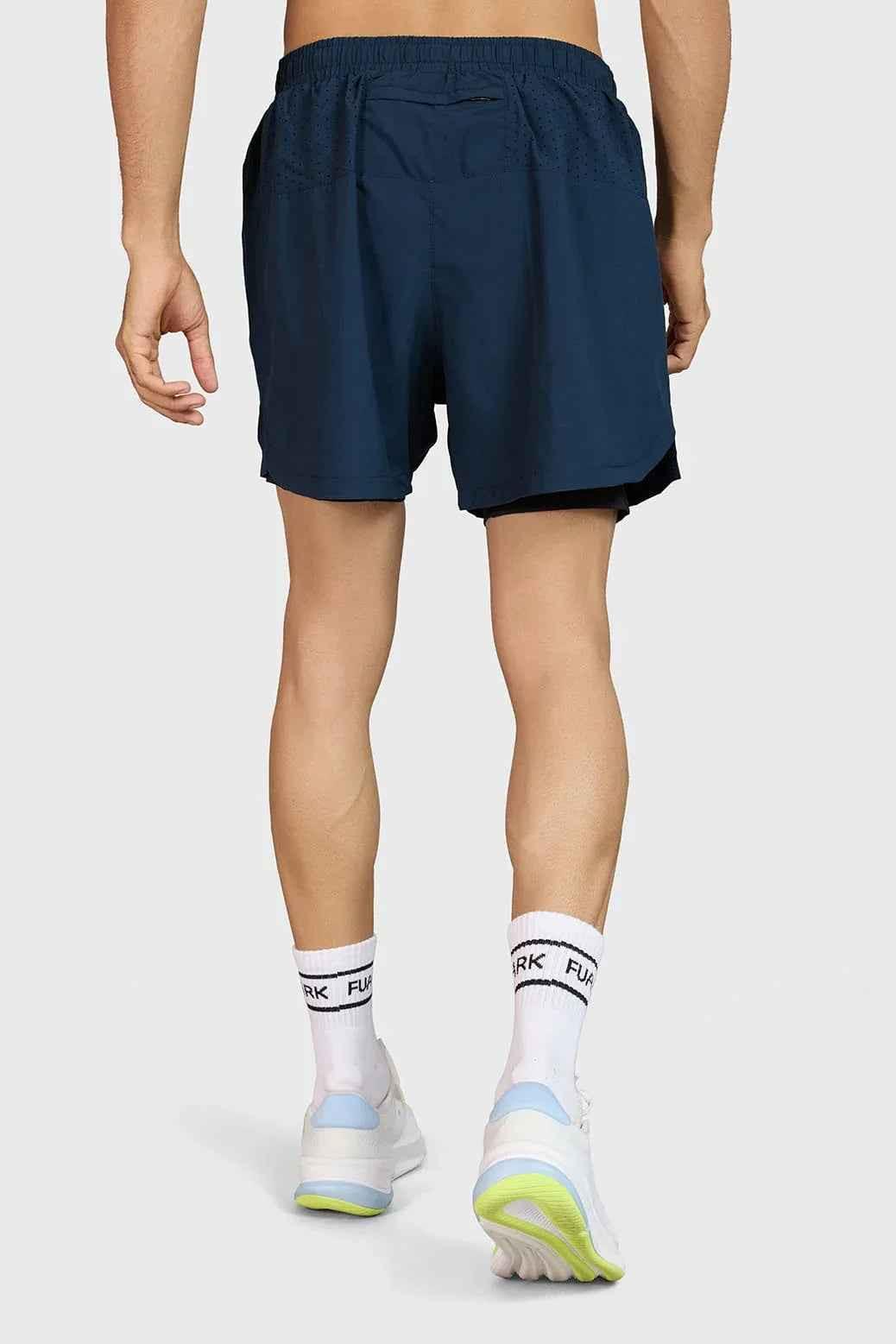 Fuaark Nz Hyper 5-inch navy running shorts, lightweight and comfortable athletic wear, shown on a model for active sports.
