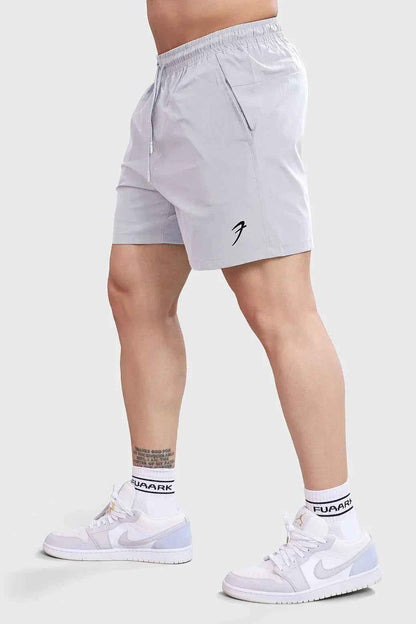 Light grey Fuaark Nz shorts with thread detailing, designed for active lifestyles and casual wear.