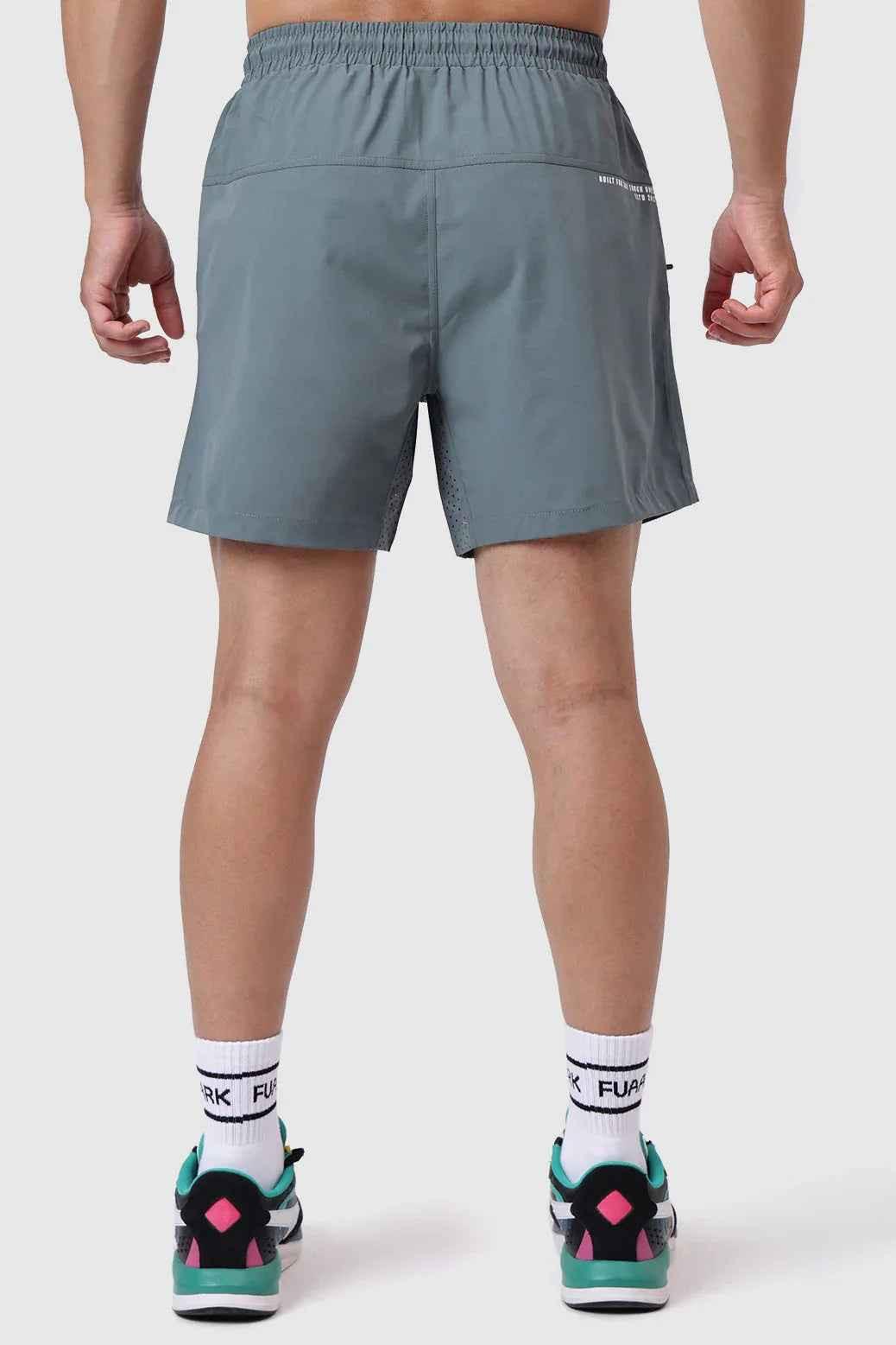 Forest green Fuaark Nz Nova Shorts displayed on a model, showcasing casual fit and comfortable design.