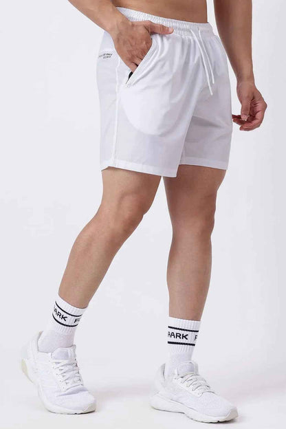 White Nova Shorts by Fuaark Nz displayed on a model, showcasing casual fit and lightweight fabric.