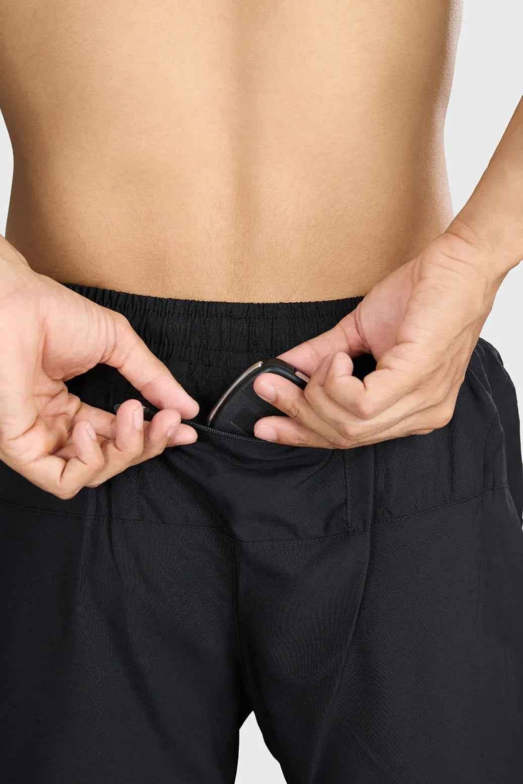 Black Pulse 4-inch running shorts by Fuaark Nz, lightweight athletic shorts for running and active wear.