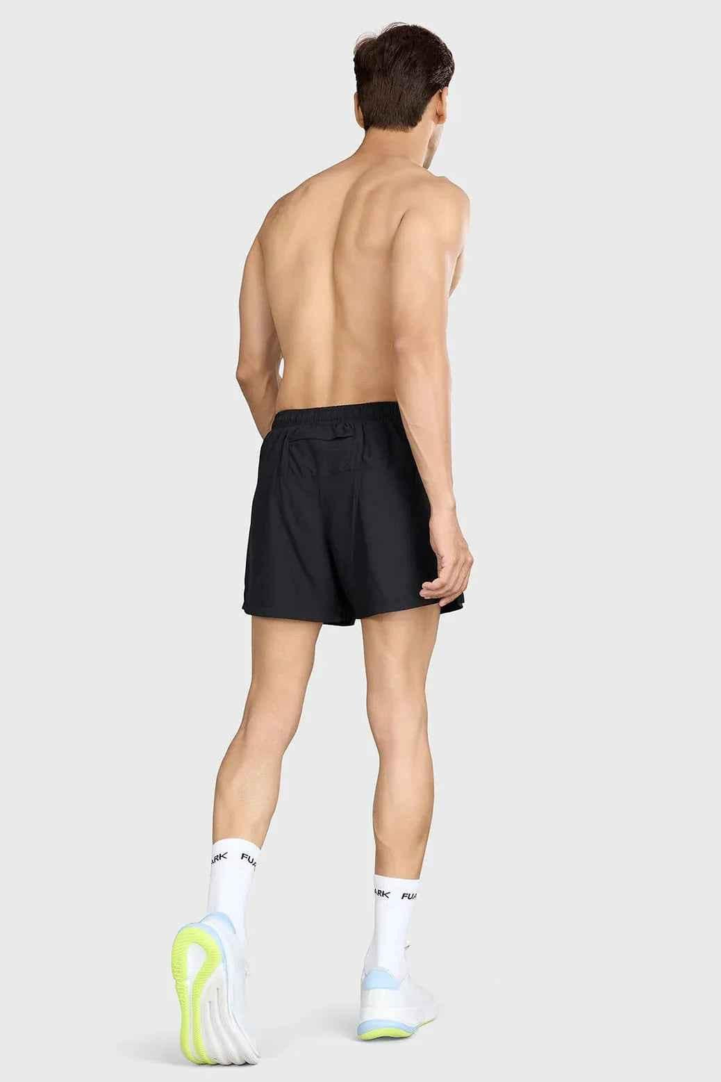 Black Pulse 4-inch running shorts by Fuaark Nz, featuring lightweight fabric and athletic fit for comfortable running.