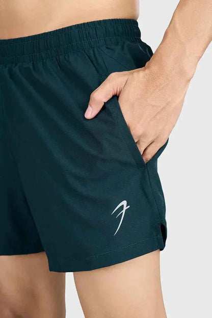 Deep green Fuaark Nz Pulse 4-inch running shorts, lightweight athletic shorts with a comfortable fit for running and active wear.