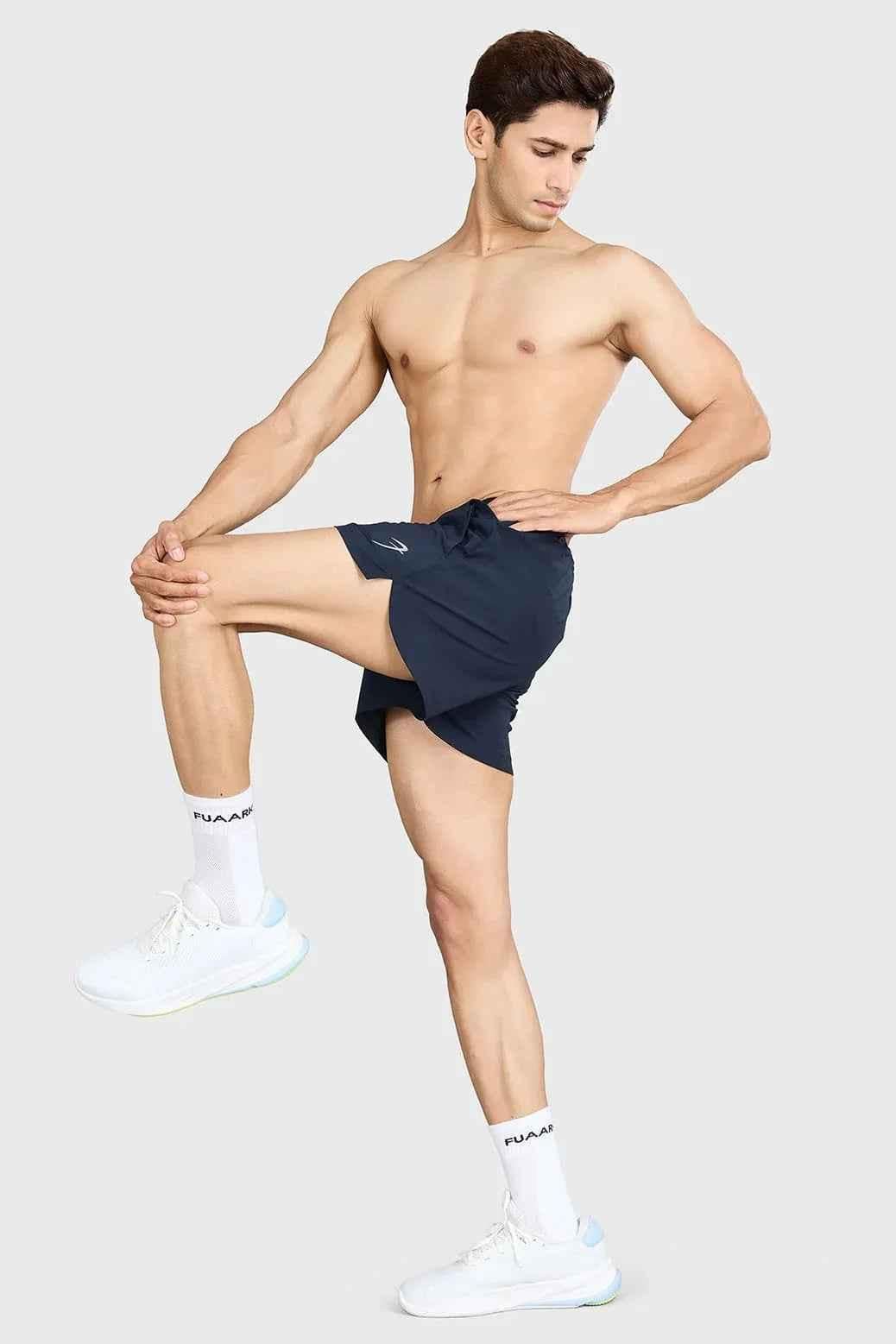Fuaark NZ Pulse 4-inch navy running shorts with breathable fabric and elastic waistband for active athletic wear.