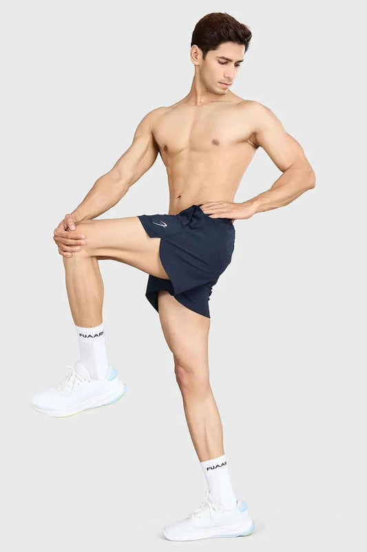 Fuaark NZ Pulse 4-inch navy running shorts with breathable fabric and elastic waistband for active athletic wear.
