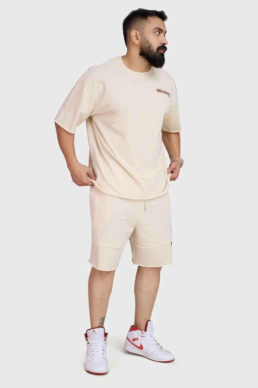 Beige Raw Edge Oversized Shorts by Fuaark Nz, casual shorts with raw hem and relaxed fit, shown on model.