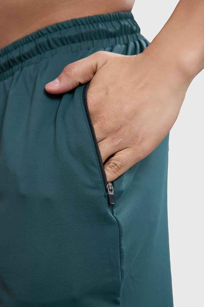 Forest green Rush Shorts by Fuaark Nz, casual men's shorts with a relaxed fit and comfortable waistband, front and side view.