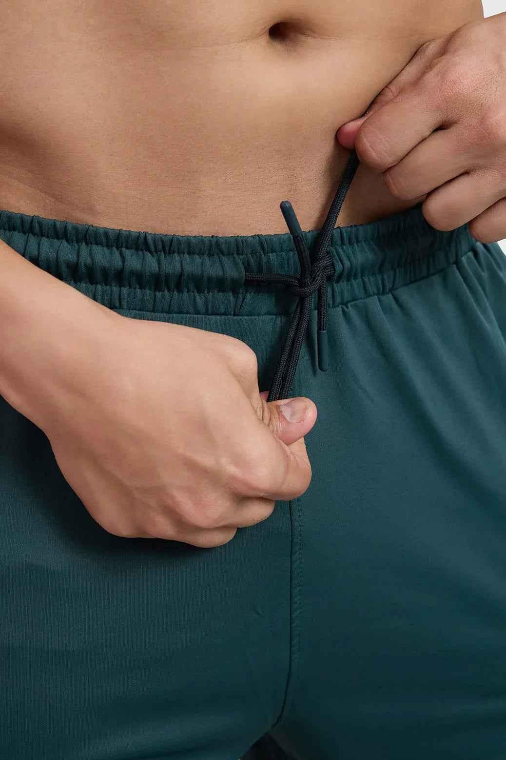Fuaark Nz Rush Shorts in forest green, lightweight casual shorts with a relaxed fit, suitable for outdoor activities.