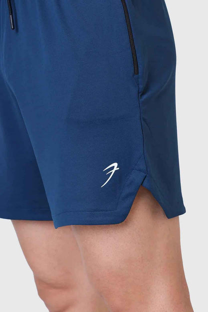 Fuaark Nz Rush Shorts in teal color, casual shorts with a comfortable fit, shown on a model.
