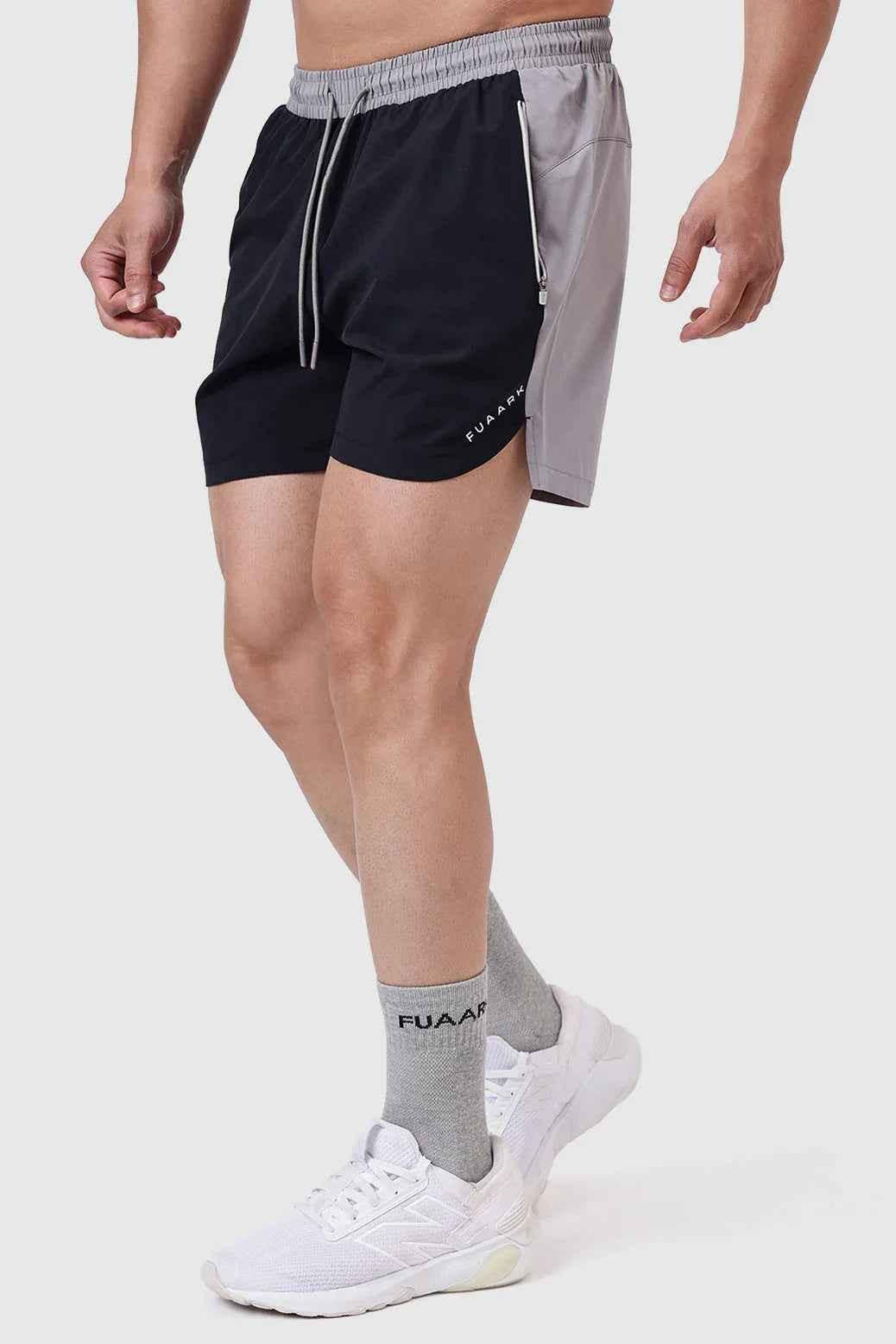 Black Snap Colourblock Shorts by Fuaark NZ, showing the sporty design and vibrant colourblock pattern on the shorts.