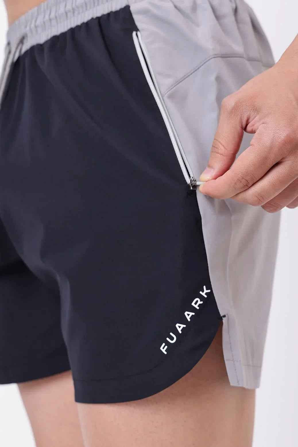 Black Snap Colourblock Shorts by Fuaark Nz featuring a stylish colorblock design and casual fit.